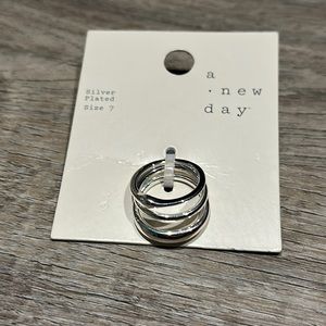 three silver plated rings